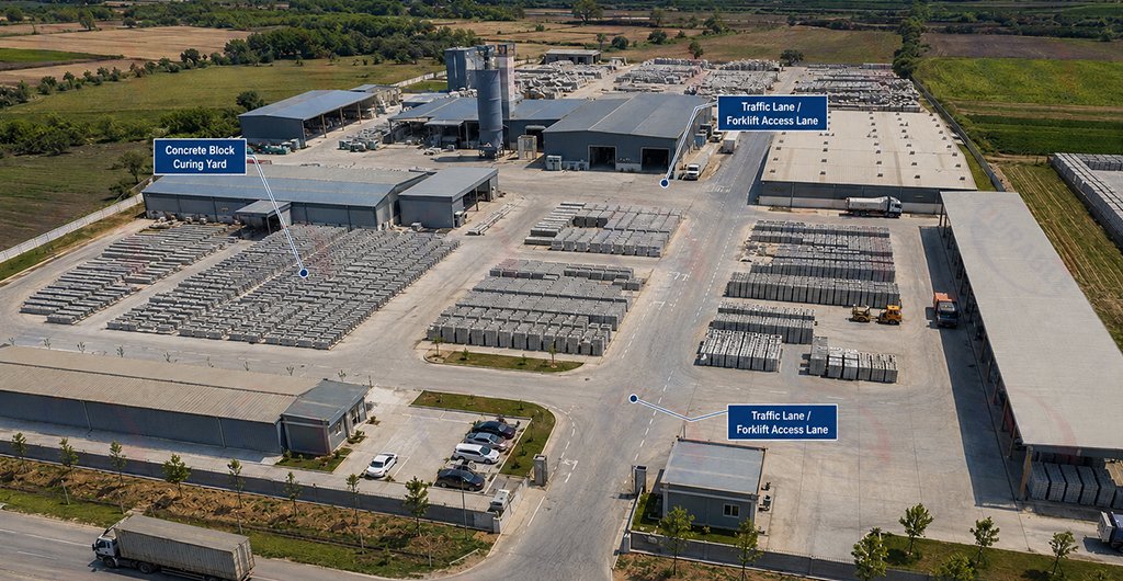 Concrete block curing yard with organized forklift access